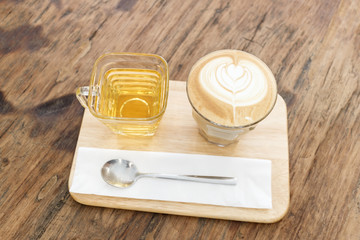 Cup of coffee latte art on wood table