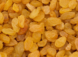 Yellow raisin as background