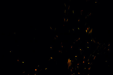 fire flames with sparks on a black background © studybos
