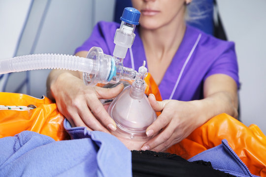 Hands nurses with oxygen mask