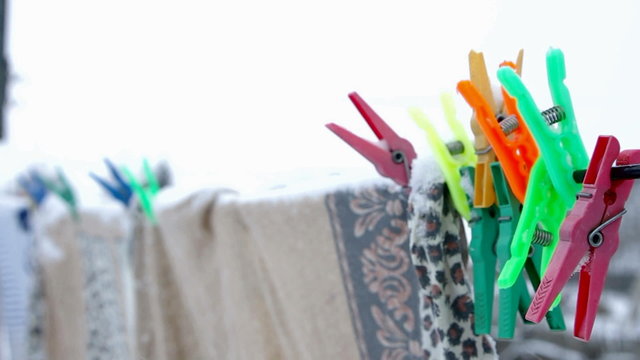 Multicolored shopping clothespins on rope
