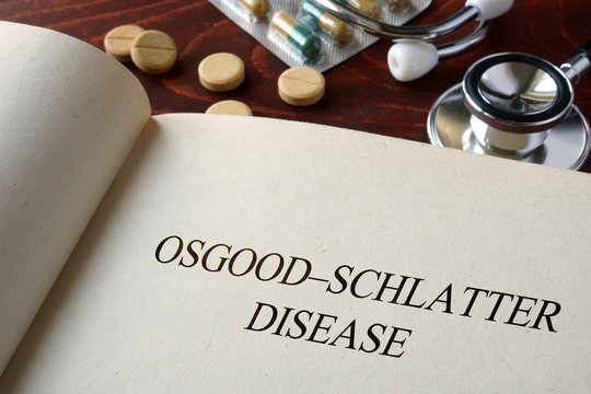 Book With Diagnosis Osgood–Schlatter Disease And Pills. Medical Concept.