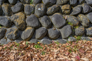 black stone wall  in national park of Nikko, Japan