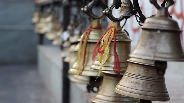 Bells at a Hindu temple on the island on Lake Phewa in Pokhara, Nepal