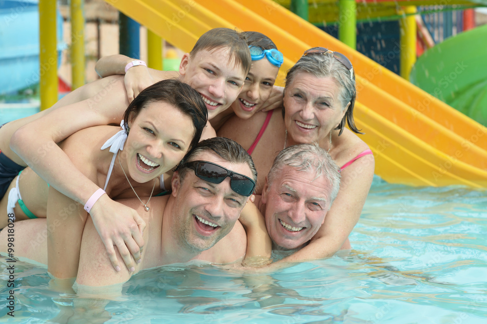 Wall mural family relax in pool