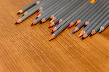 Obraz premium colored pencils on wooden background
