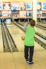 Kid playing bowling