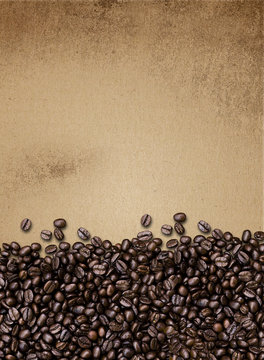 coffee beans on paper texture, vintage background 