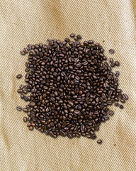 coffee beans on traditional sack textile background