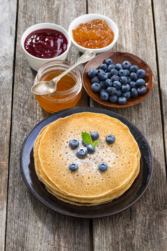 crepes with fresh blueberries, jams and honey