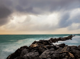winter seascape with breakwater and rough sea