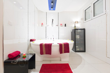 Interior of a luxury white bathroom with jacuzzi bath