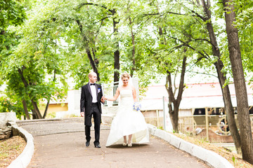 Bride and groom in the park