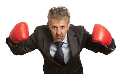 Businessman in red boxing gloves