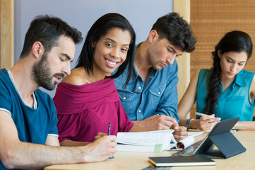 Happy students at library