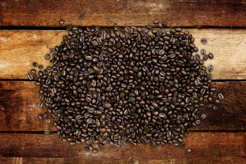 Coffee beans on wood background