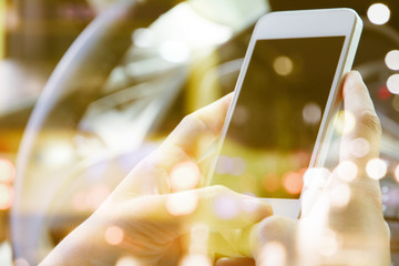  image of people sitting in the car using smart phone double exposure and blurred view of car on ...