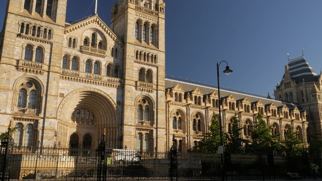 Pan across the front of the Natural History Museum in London. Shot in 4K on a sunny morning