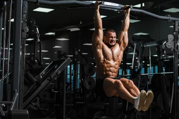 Foto op Aluminium Athlete muscular fitness male model pulling up on horizontal bar © Fotokvadrat