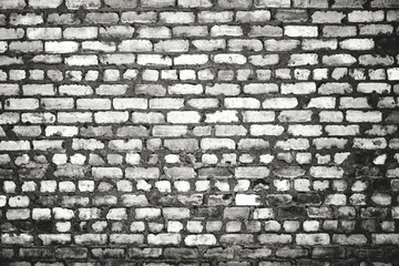 Dirty brick wall in monochrome