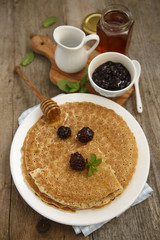 Pancakes with berries and honey