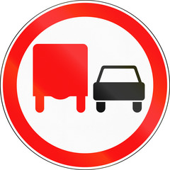 Road sign used in Russia - No overtaking by heavy goods vehicles