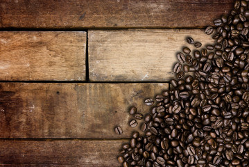 Coffee beans on wood background
