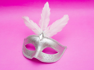 Carnival mask isolated on pink background