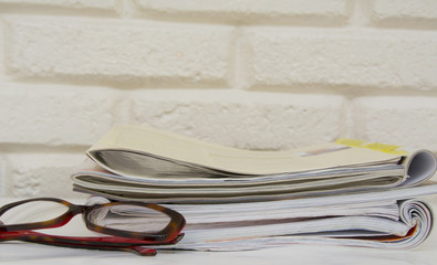 Stack of magazines on table, close up