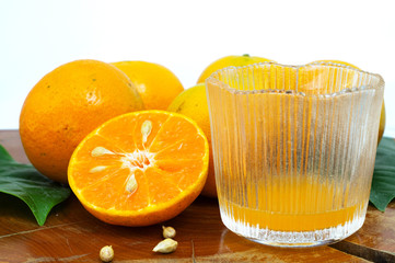 Fresh orange and juice in glass