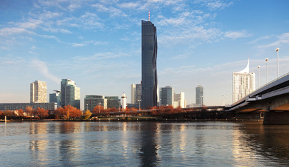 Naklejka na ściany i meble View on a modern city with a water reflection