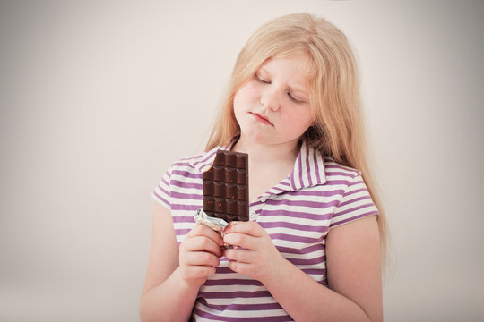  Worried Girl Eating Chocolate