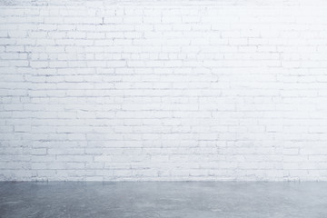 White brick wall and concrete floor in empty room