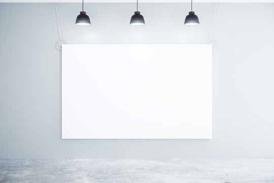 Blank white poster on the wall with lamps, mock up