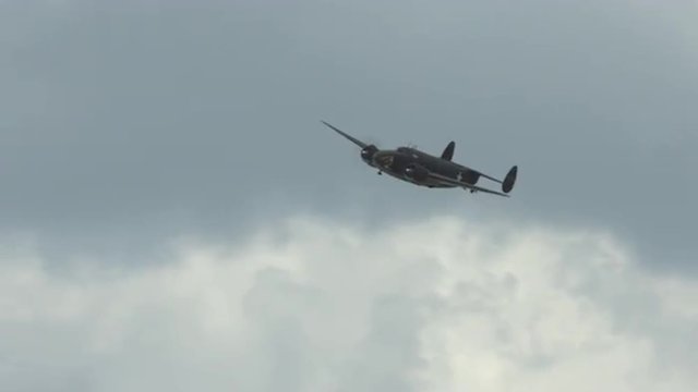 World War II military transport aircraft, Lockheed C-60 Lodestar, approaches and flies close to camera.  Recorded in 4K, ultra high definition.