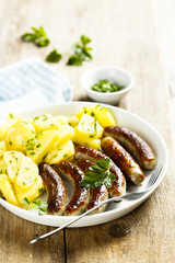 Fried sausages with potato salad