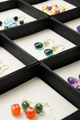 Display af handmade gemstone earrings