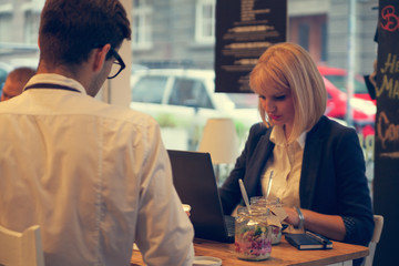Business Couple In Cafe