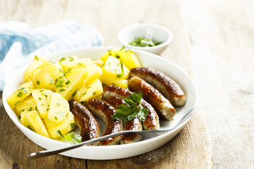 Fried sausages with potato salad