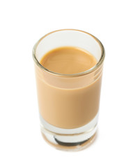 Shot of cream liqueur isolated