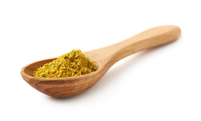 Wooden spoon of curry isolated