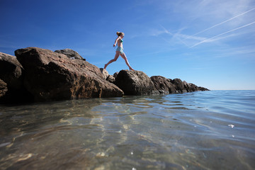 Girl exercising at seashore