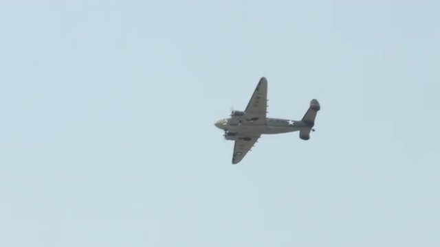 World War II military transport aircraft, Lockheed C-60 Lodestar, flies overhead  Recorded in 4K, ultra high definition.