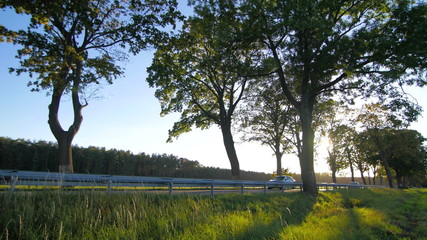 Secondary road with light traffic in the countryside slow pan