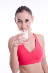 cheerful young woman drinking milk