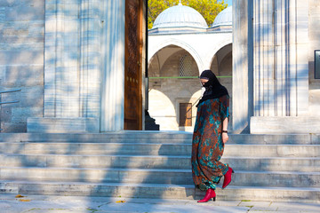 Muslim Woman walking on Marble stairs of Mosque - Powered by Adobe