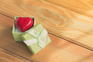 Gift of love. hearty gift. A gift box with a red heart inside.