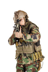 Fototapeta premium young ranger standing with a machine gun at white background