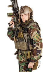 young ranger standing with a machine gun at white background