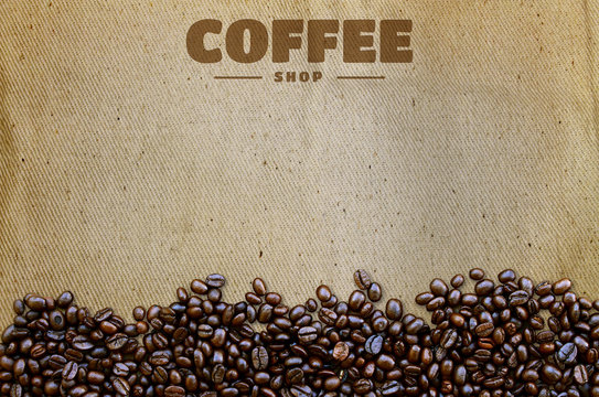 Coffee beans on old fabric texture background
